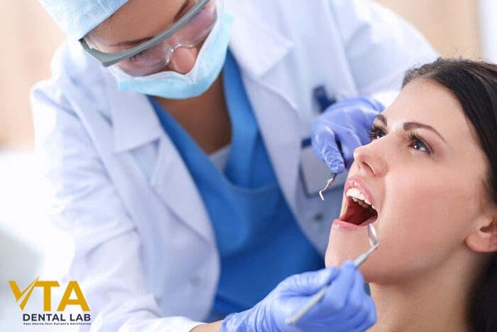 Dentist checks oral health