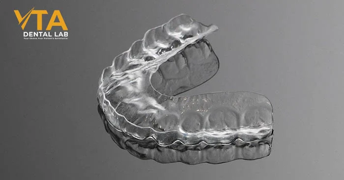 A clear soft occlusal guard made of flexible material