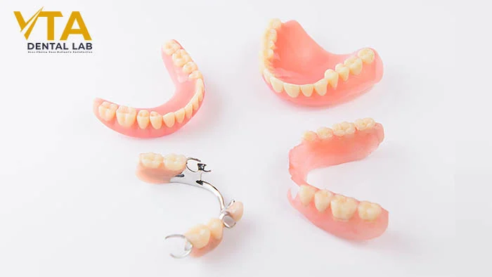Removable dentures consist of a gum-colored resin base and prosthetic teeth